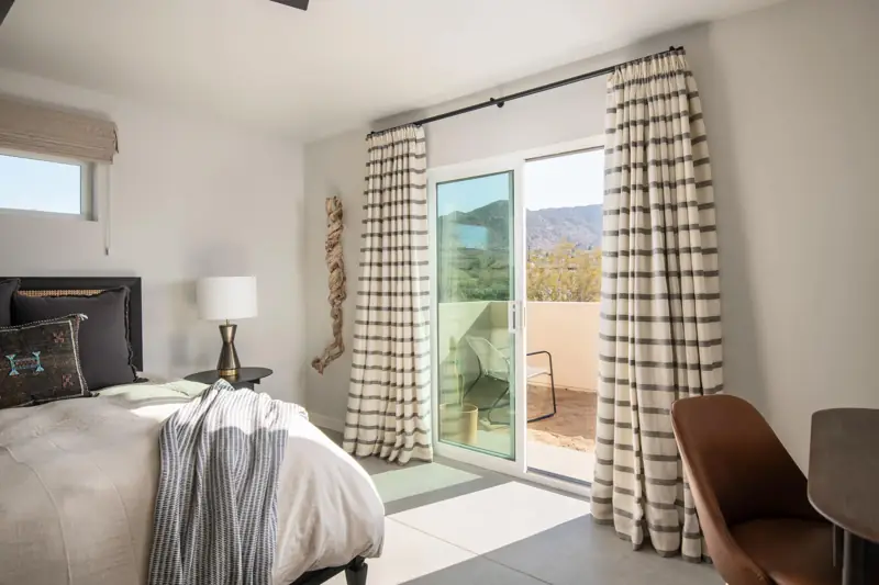 Bedroom 1: The master bedroom has a king bed, luxurious bedding, a writing desk with a chair. Blackout curtains and shades. It is connected to the sumptuous master bathroom. Sonos speaker for music.