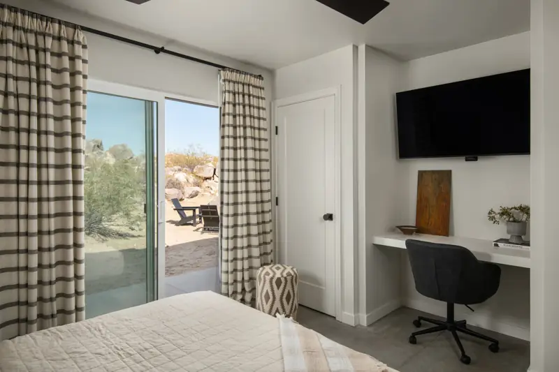 Bedroom 2: The second bedroom features a king bed with luxurious bedding and a comfortable mattress. It also has a 48" 4K Sony OLED TV, a writing desk and chair. Blackout curtains.