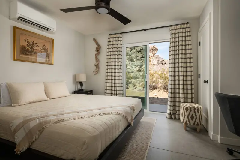 Bedroom 2: The second bedroom features a king bed with luxurious bedding and a comfortable mattress. It also has a 48" 4K Sony OLED TV, a writing desk and chair. Blackout curtains.