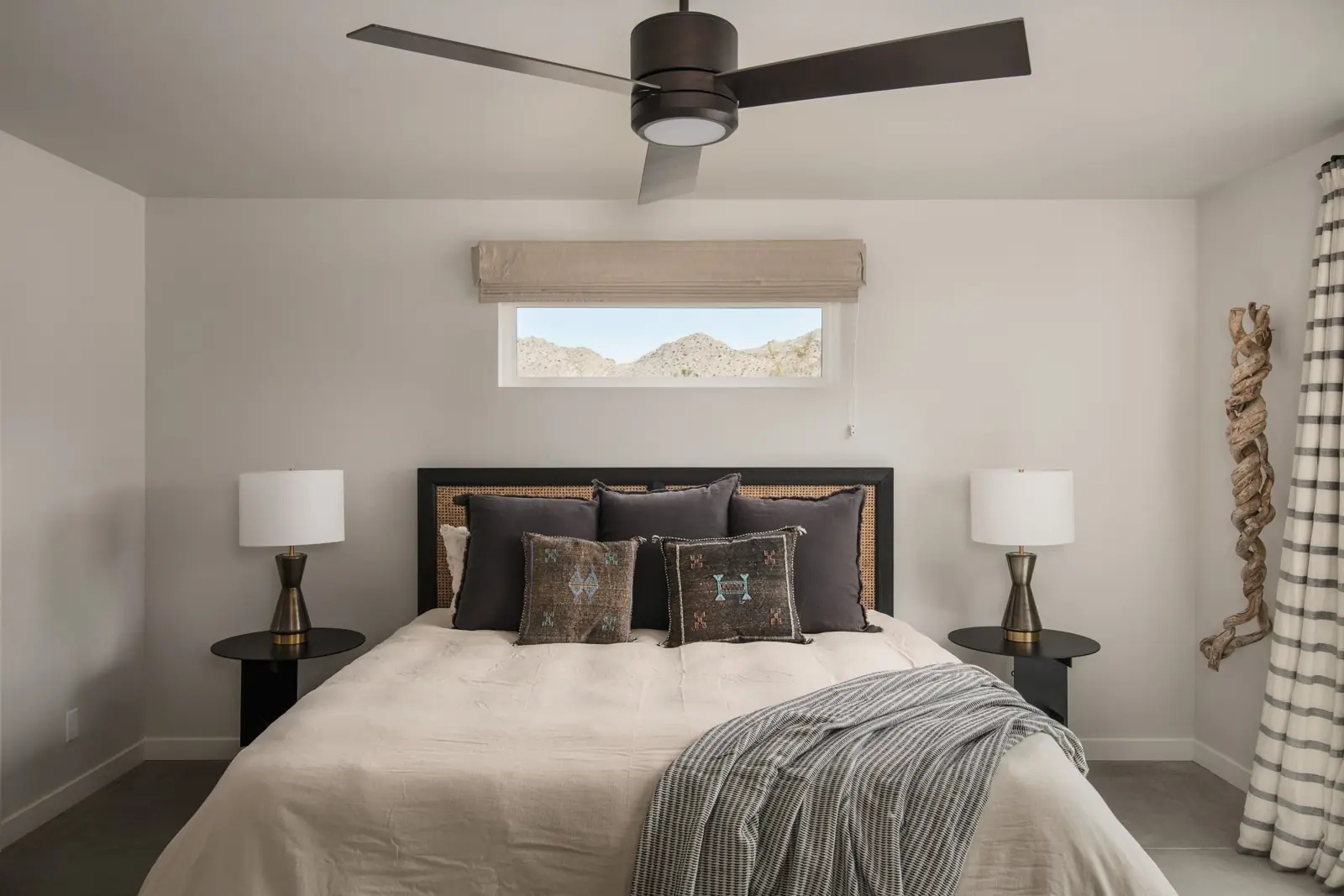 Primary bedroom with king bed and desert view