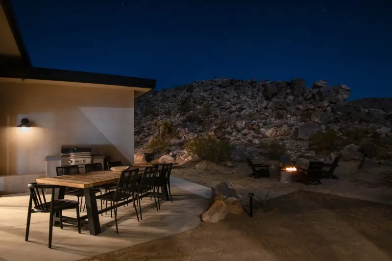Patio: A view of the backyard at night